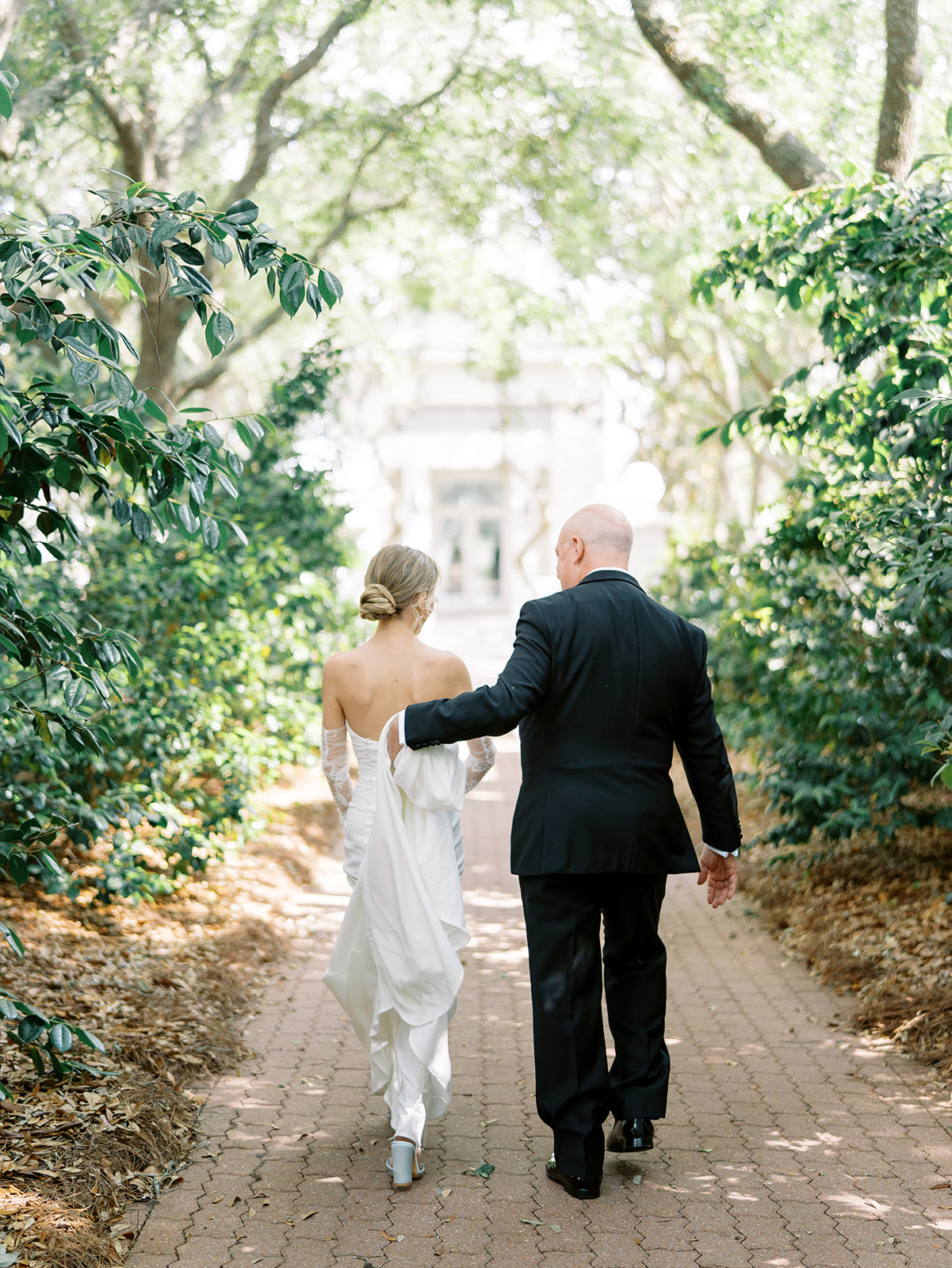 couple walking toward carillon meeting house