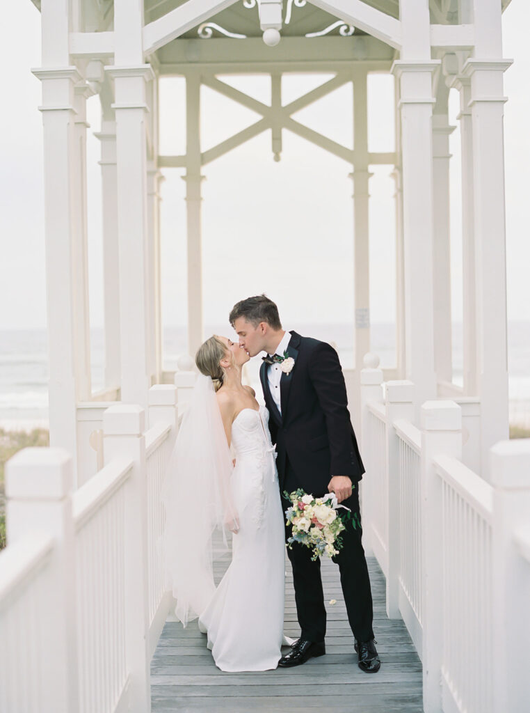 bride and groom kiss at their garden wedding at carillon 