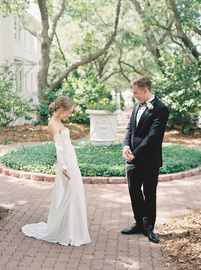 seeing each other for the first time at garden wedding at carillon 