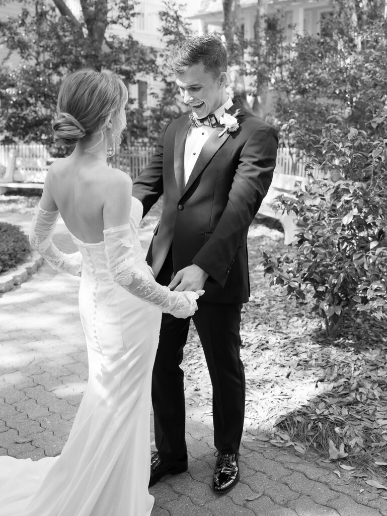 groom sees his bride for the first time at garden wedding at carillon 