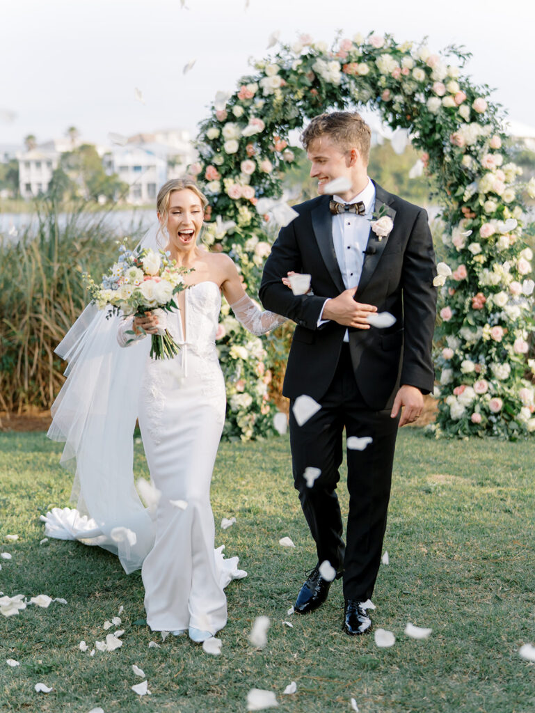 walking down the aisle at garden wedding at carillon 