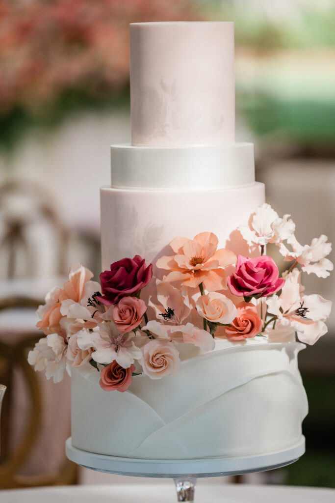 pink floral accents on wedding cake at carillon wedding