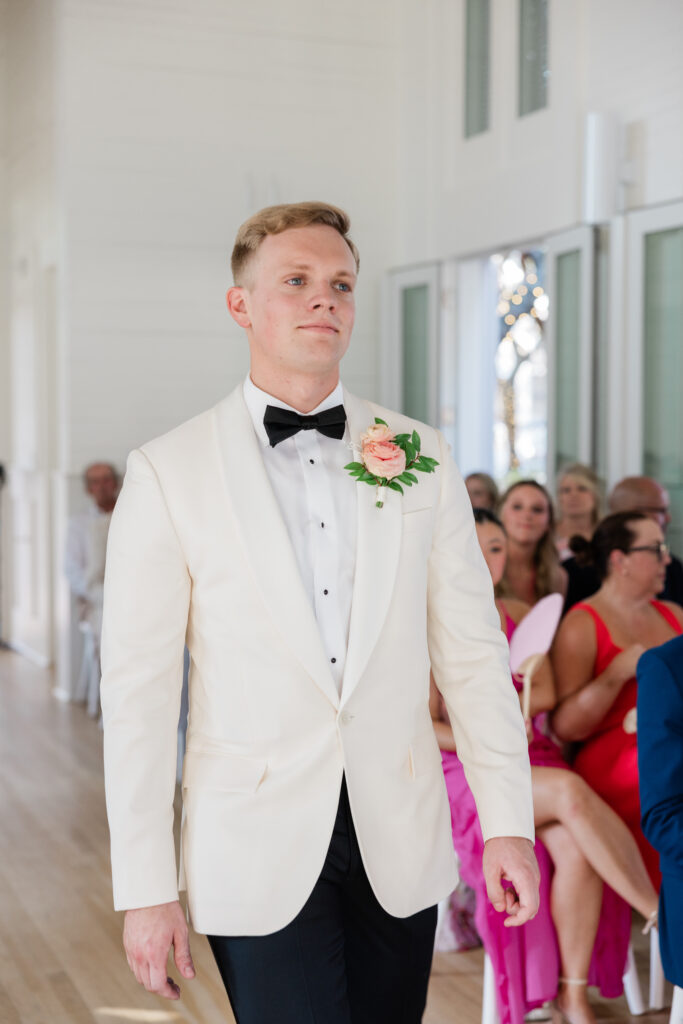 groom at ceremony at meeting house wedding Florida