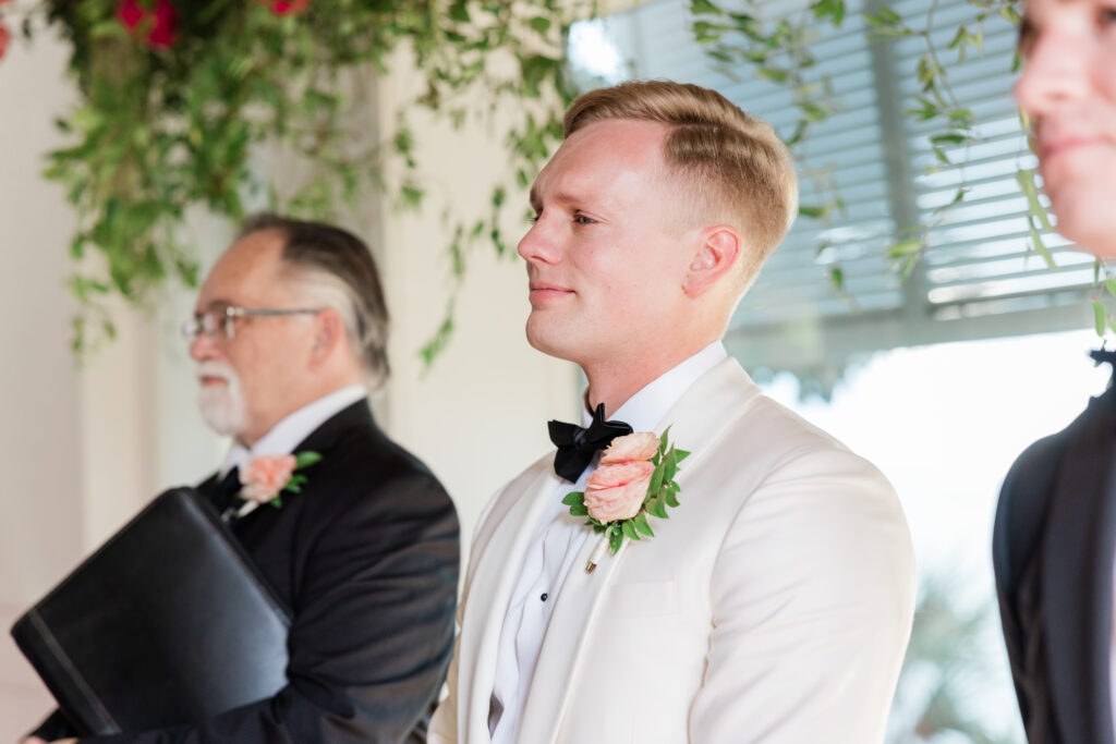 emotional groom seeing his bride for the first time carillon wedding