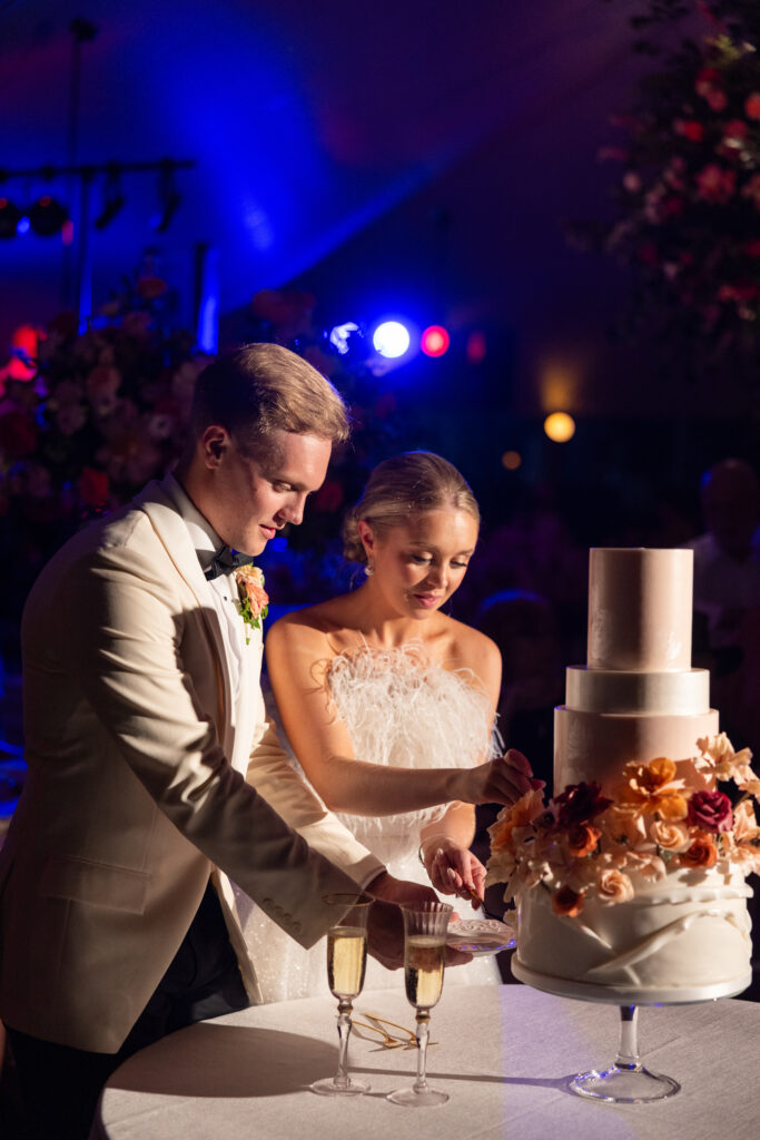 cutting the cake at 30A wedding in carillon