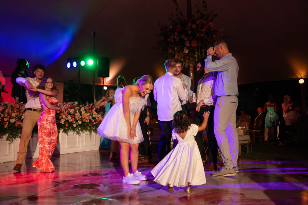 bride dancing with flower girl at carillon wedding