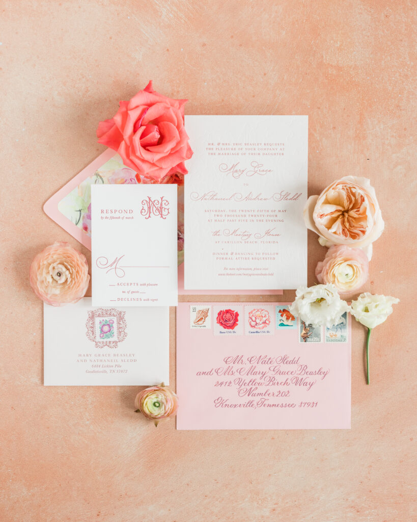 colourful flat lay photo of invitations for 30A wedding at carillon