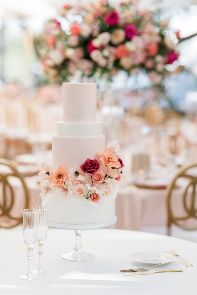 beautiful white cake with pink floral details