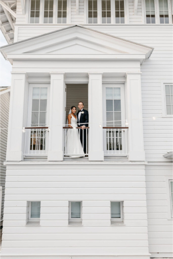 balcony photos of the newly weddings at their seaside wedding